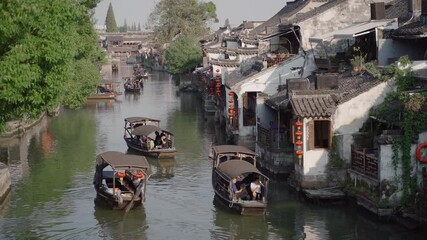 Scenic Views of Xitang Ancient Town, China, Tourist Boats on the River and Ancient Architecture Along the Banks 
