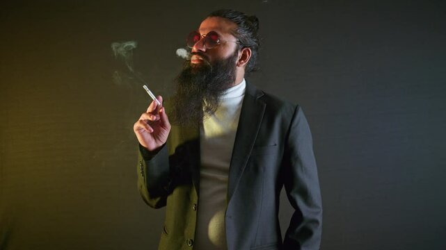 Pensive Bearded Man Stand in suit Smoking