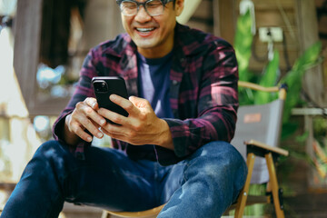 man using mobile phone holding cell phone texting message contact us.chatting,search internet shopping online.device communication connecting