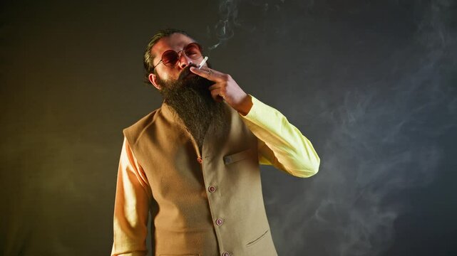 Engineer wearing smart jacket savors tobacco roll