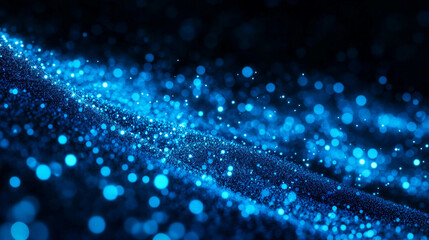 Obraz premium A vibrant blue abstract background with glowing particles and a dark, textured surface beneath them