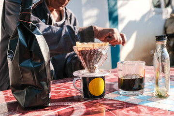 People morning talk with drip brewing coffee by paper filtered on table