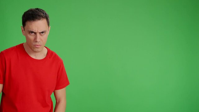 Man expressing disgust and displeasure on green screen
