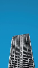 Obraz premium City skyscraper, blue sky, urban architecture, exterior view, modern building