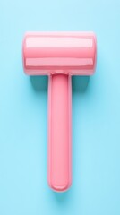 Fototapeta premium Pink rubber mallet on blue background; craft, DIY