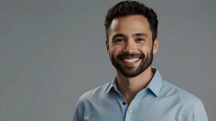 Obraz premium Smiling Man Holding Smartphone – Professional Studio Portrait on White Background
