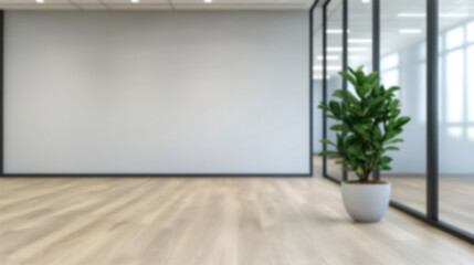 Fototapeta premium A modern, airy office space featuring a potted plant beside a glass-paneled wall, suggesting a bright, contemporary environment with ample natural light and minimalist design.
