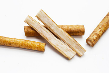 Burdock Root (Gobo) on white background.