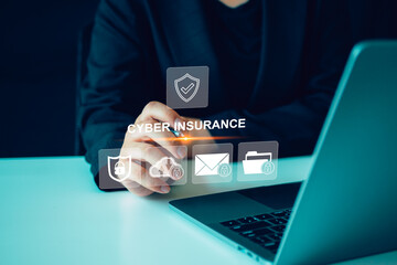 Cyber insurance concept. Insurance that protects your organization from cyber threats. Person use laptop with cyber insurance icon on virtual screen	