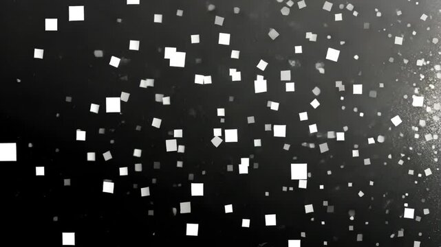Dazzling white squares floating over a dark background creates an enchanting visual display in a dynamic setting