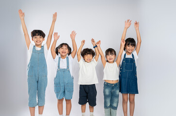 Fototapeta premium group image of cute asian kids posing on white background