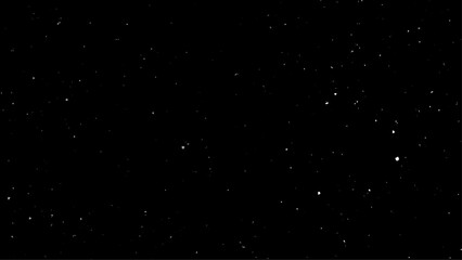 Snowstorm texture. Bokeh lights on black background, shot of flying snowflakes in the air. Snowstorm texture. 