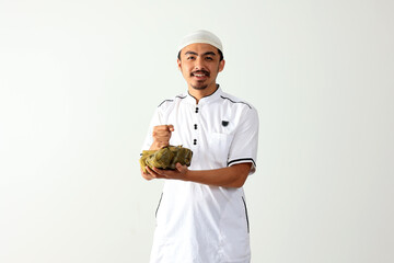 Asian man Holding Ketupat Celebrating Eid Al Fitr Lebaran Mubarak