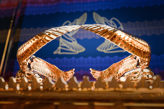The golden Cherubim on top of the Ark of the Covenant, view towards the inner veil of the sanctuary. 3d rendering tabernacle Bible illustration.