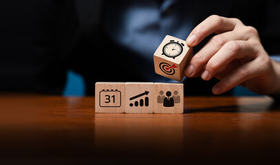 Effective Time Management and Productivity Concept with Hand Arranging Wooden Blocks Featuring Calendar, Goal, Growth, Team Icons to Showcase Planning, Organization, Efficiency, Success in Business
