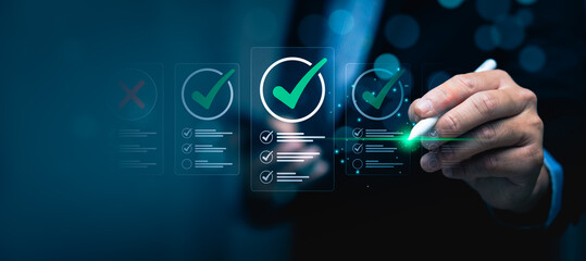 Business Professional Using Digital Pen to Mark Checklists on a Virtual Screen with Green...