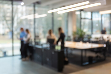 Blurred image of business people standing in the office