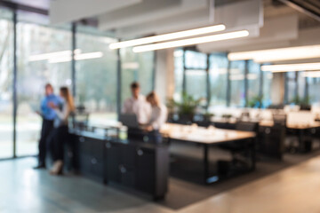 Blurred image of business people standing in the office