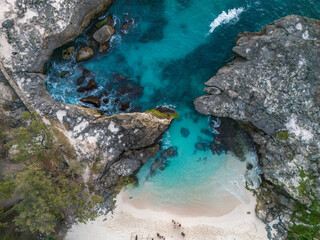 Southwest Sumba, East Nusa Tenggara, Indonesia &ndash;  07. 14. 2024 &ndash; From above, the dramatic inlet through which Mandorak&rsquo;s fishing boats pass between giant karst rocks to reach the open waters of South 