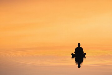 Meditating silhouette on water