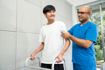 Fototapeta premium Physical therapy. Male Nurse aids young man in recovering from spine injury and providing orthopedic massage Orthopedic healthcare and chiropractor with person for physical therapy rehabilitation