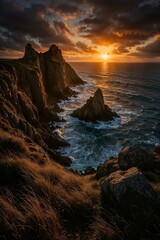 Fototapeta premium Dramatic Sunset Over Rugged Rocky Coastline Seascape