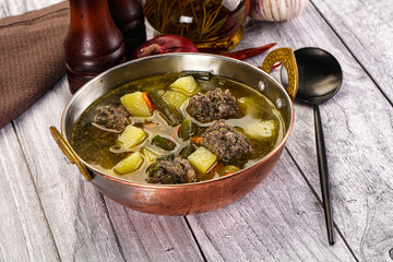 Soup with beef meatballs and vegetables