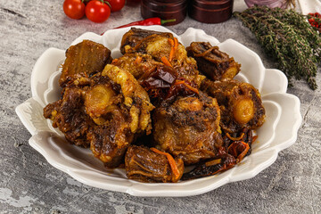 Baked oztail with tomato and carrot