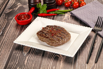Grilled beef burger cutlet with sauce