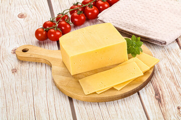 Yellow cheese piece with slices