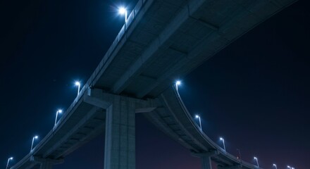 Concrete highway overpass at night
