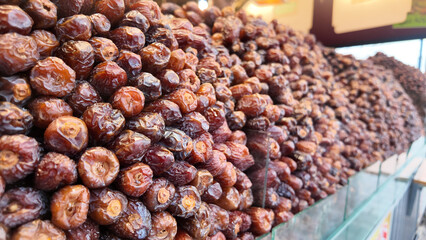 Dried dates arranged in abundance at a market stall