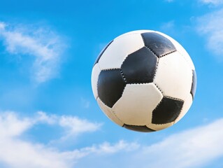 Soccer ball against blue sky