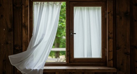 Wooden cabin window with white curtains billowing in the breeze