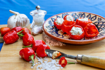 Processing sweet piquante peppers for an appetizing healthy food snack displayed on a beautiful...