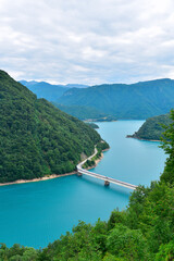 Bridge over lake Piva reservoir from Piva canyon viewpoint. Beautiful Montenegro nature landscape, explore the Balkans, travel Europe.