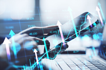 Businessperson using smartphone with financial stock market data overlay.