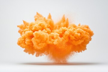 Orange powder explosion on white