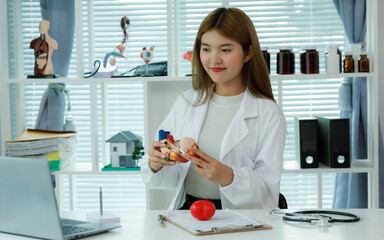 A female doctor who advises patients on heart health, disease prevention, and treatment, including...