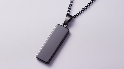 Fototapeta premium Sleek Pendant Necklace: A minimalist aesthetic, featuring a contemporary black pendant suspended from a matching chain, casting shadows.