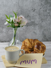 Special breakfast with flowers with a sign with the word 