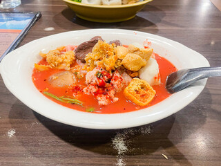 small flat rice noodles with fish balls and shrimp balls in pink soup, Yen Ta Four or Yen Ta Fo - Asian food style