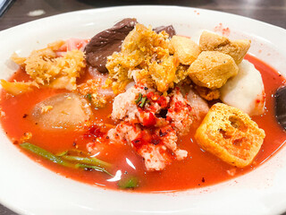 small flat rice noodles with fish balls and shrimp balls in pink soup, Yen Ta Four or Yen Ta Fo - Asian food style