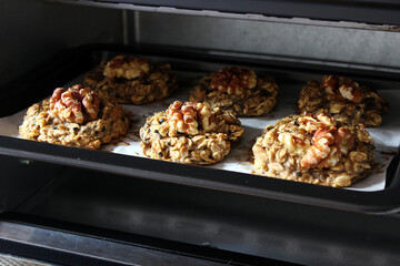 Homemade oat and banana cookies in the oven, dessert for vegan
