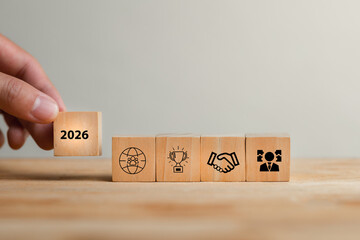 Wooden Blocks with Icons Representing Goals and Milestones for 2026