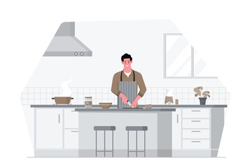 Man cooking in the kitchen cutting vegetables on a counter