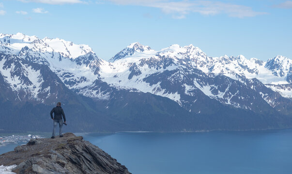 A Snowy Adventure of a Man On Top of Mt. Marathon in Seward, Alaska