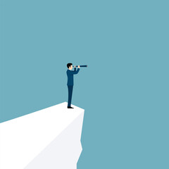 Visionary leadership concept with businessman looking through telescope from cliff