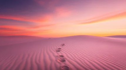 Selbstklebende Fototapeten Tranquil Desert Landscape with Footprints on Sand at Twilight Under a Colorful Sky of Soft Pink and Purple Hues © iLada