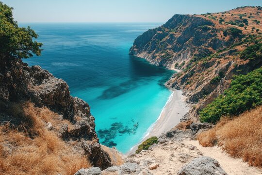 One side is blue water and brown hills, the other side is green vegetation and white sandy beaches
